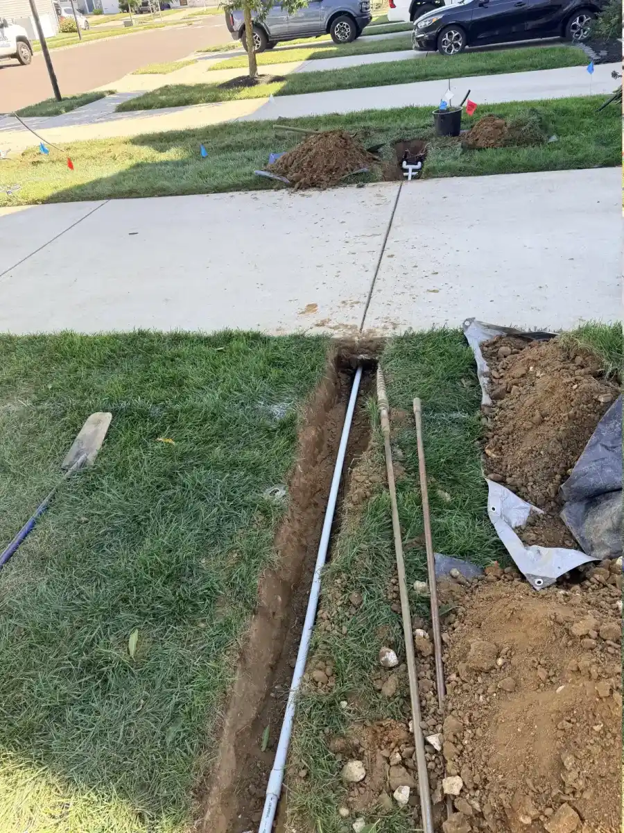 Residential irrigation pipe trenching during a South Jersey installation