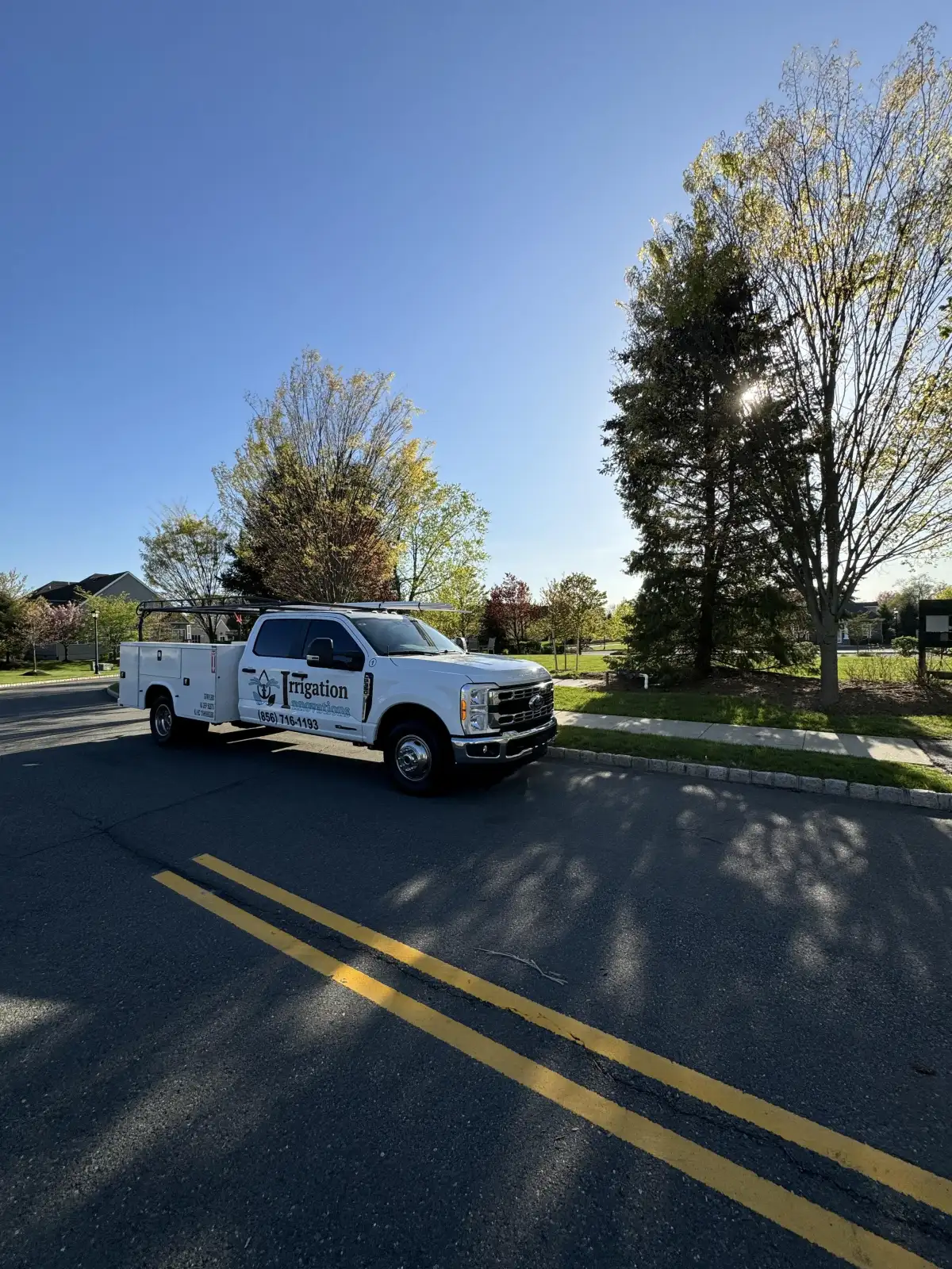 Irrigation Innovations branded truck in residential neighborhood